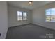 Cozy carpeted bedroom with natural light from large windows overlooking the neighborhood at 263 Luray Way # 444, Rock Hill, SC 29730