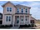 Charming two-story home featuring a welcoming front porch and manicured landscaping at 263 Luray Way # 444, Rock Hill, SC 29730