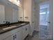 Modern bathroom featuring double sinks, quartz countertops, and sleek black hardware at 267 Luray Way # 445, Rock Hill, SC 29730