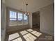 Sun-filled dining area with a large window and a modern light fixture at 267 Luray Way # 445, Rock Hill, SC 29730