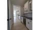 Hallway with glass cabinets, wine cooler, and a view of the kitchen at 267 Luray Way # 445, Rock Hill, SC 29730