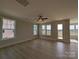 Bright living room with hardwood floors, multiple windows and a ceiling fan at 267 Luray Way # 445, Rock Hill, SC 29730