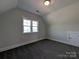 This bedroom features gray carpet, neutral walls, and a window with natural light at 275 Luray Way # 447, Rock Hill, SC 29730