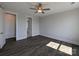 Cozy bedroom featuring wood floors, a ceiling fan, and ample natural light at 275 Luray Way # 447, Rock Hill, SC 29730