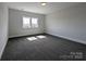 This bedroom features plush gray carpeting and a large window that allows natural light to fill the room at 275 Luray Way # 447, Rock Hill, SC 29730