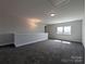 Large bonus room with carpet, natural light from a window, and chandelier lighting at 275 Luray Way # 447, Rock Hill, SC 29730