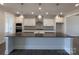 Modern kitchen with white cabinets, stainless steel appliances, and pendant lighting over the island at 275 Luray Way # 447, Rock Hill, SC 29730