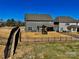 Expansive backyard with modern home featuring a playset, offering a comfortable and Gathering-friendly outdoor space at 278 W Waterlynn Rd, Mooresville, NC 28117