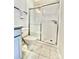 Bathroom featuring a toilet and a shower with white subway tile and a sliding glass door at 278 W Waterlynn Rd, Mooresville, NC 28117