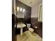 Elegant half-bathroom with patterned wallpaper, pedestal sink, and modern fixtures at 278 W Waterlynn Rd, Mooresville, NC 28117