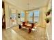 Cozy dining area featuring a wooden table, comfortable bench seating, and views of the outdoor space at 278 W Waterlynn Rd, Mooresville, NC 28117