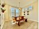 Charming dining area with a wooden table, bench seating, and natural light, perfect for Gathering meals at 278 W Waterlynn Rd, Mooresville, NC 28117