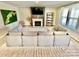 Spacious living room with a tiled fireplace, leafy accents, and a large window at 278 W Waterlynn Rd, Mooresville, NC 28117