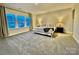 Main bedroom with large windows that provide ample natural light and neutral decor at 278 W Waterlynn Rd, Mooresville, NC 28117