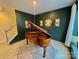 This piano room features dark walls and a beautiful piano at 278 W Waterlynn Rd, Mooresville, NC 28117