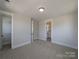 Comfortable bedroom featuring neutral walls, carpeted floors, and adjacent bathroom and closet spaces at 279 Luray Way # 448, Rock Hill, SC 29730