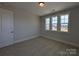 Bright bedroom featuring a triple window allowing natural light to illuminate the room at 279 Luray Way # 448, Rock Hill, SC 29730