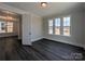 Light-filled bedroom with large windows and dark wood floors, offering a serene and stylish space at 279 Luray Way # 448, Rock Hill, SC 29730