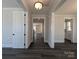 Bright hallway with modern lighting, leading to other rooms with fresh paint and dark wood floors at 279 Luray Way # 448, Rock Hill, SC 29730