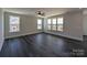 Spacious and bright living room with large windows offering abundant natural light, and dark wood floors at 279 Luray Way # 448, Rock Hill, SC 29730