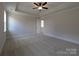 Expansive main bedroom has a tray ceiling, plush carpeting, and neutral color scheme at 279 Luray Way # 448, Rock Hill, SC 29730