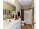 Full bathroom with decorative vases on counter and patterned shower curtain at 2802 Santiago Cir, Monroe, NC 28110