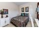 Cozy bedroom with decorative art, brown accents, and natural light at 2802 Santiago Cir, Monroe, NC 28110