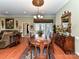 Elegant dining room featuring a wooden table, chandelier lighting, and access to living areas at 2802 Santiago Cir, Monroe, NC 28110