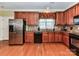 Spacious kitchen with stainless steel refrigerator and updated appliances and cabinets at 2802 Santiago Cir, Monroe, NC 28110