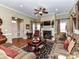 Comfortable living room with a fireplace, ceiling fan, hardwood floors, and inviting furnishings at 2802 Santiago Cir, Monroe, NC 28110