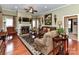 Inviting living room with fireplace, hardwood floors, and comfortable seating arrangements at 2802 Santiago Cir, Monroe, NC 28110