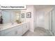 Bathroom featuring a double vanity, framed mirror, walk-in shower, and tile flooring at 3018 Sassafras Trl, Gastonia, NC 28056