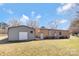 View of the back of the home with outbuilding and large backyard at 3080 Sims Rd, Rock Hill, SC 29730