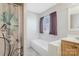 Clean bathroom featuring a shower/tub combo with a decorative shower curtain and neutral paint at 3080 Sims Rd, Rock Hill, SC 29730