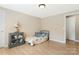 Bright bedroom featuring neutral paint, laminate flooring, and ample closet space for storage at 3080 Sims Rd, Rock Hill, SC 29730