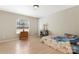 Neutral bedroom featuring a light blue cabinet, natural light, and laminate flooring at 3080 Sims Rd, Rock Hill, SC 29730