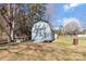 Outdoor barn structure with double doors on a grassy lot with some trees at 3080 Sims Rd, Rock Hill, SC 29730