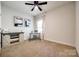 Bright bedroom with neutral carpet, a desk, and natural light from the window at 317 Praline Way, Fort Mill, SC 29715