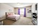 Charming bedroom featuring neutral carpet, natural light, and pink accents for a playful touch at 317 Praline Way, Fort Mill, SC 29715