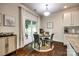 Bright dining area with a round table and access to an outdoor patio through sliding glass doors at 317 Praline Way, Fort Mill, SC 29715