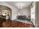 Dining room with hardwood floors, natural light and modern chandelier at 317 Praline Way, Fort Mill, SC 29715