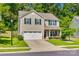 Charming two-story home with a well-manicured front yard, two-car garage, and inviting entrance at 317 Praline Way, Fort Mill, SC 29715