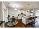 Well-lit kitchen with a large island, stainless steel appliances and breakfast area at 317 Praline Way, Fort Mill, SC 29715