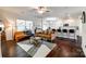 Spacious living room with dark wood floors, connected to the kitchen and dining areas at 317 Praline Way, Fort Mill, SC 29715