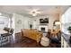 Inviting living room with a fireplace, dark hardwood floors, and stylish furnishings at 317 Praline Way, Fort Mill, SC 29715