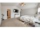 Main bedroom features vaulted ceiling, carpet flooring, walk in closet and an adjacent bathroom at 317 Praline Way, Fort Mill, SC 29715