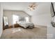 Large main bedroom with vaulted ceilings, neutral carpet, and a comfortable bed at 317 Praline Way, Fort Mill, SC 29715