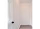 Hallway featuring clean, bright walls, new flooring, and a crisp, simple design at 35494 Dry Rd, Albemarle, NC 28001