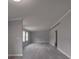 Living room featuring neutral paint, white trim, and vinyl plank flooring throughout at 35494 Dry Rd, Albemarle, NC 28001