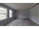 Living room featuring neutral paint, white trim, and vinyl plank flooring throughout at 35494 Dry Rd, Albemarle, NC 28001